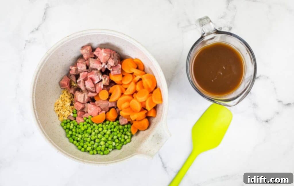 The filling ingredients in a bowl next to a jug of gravy.