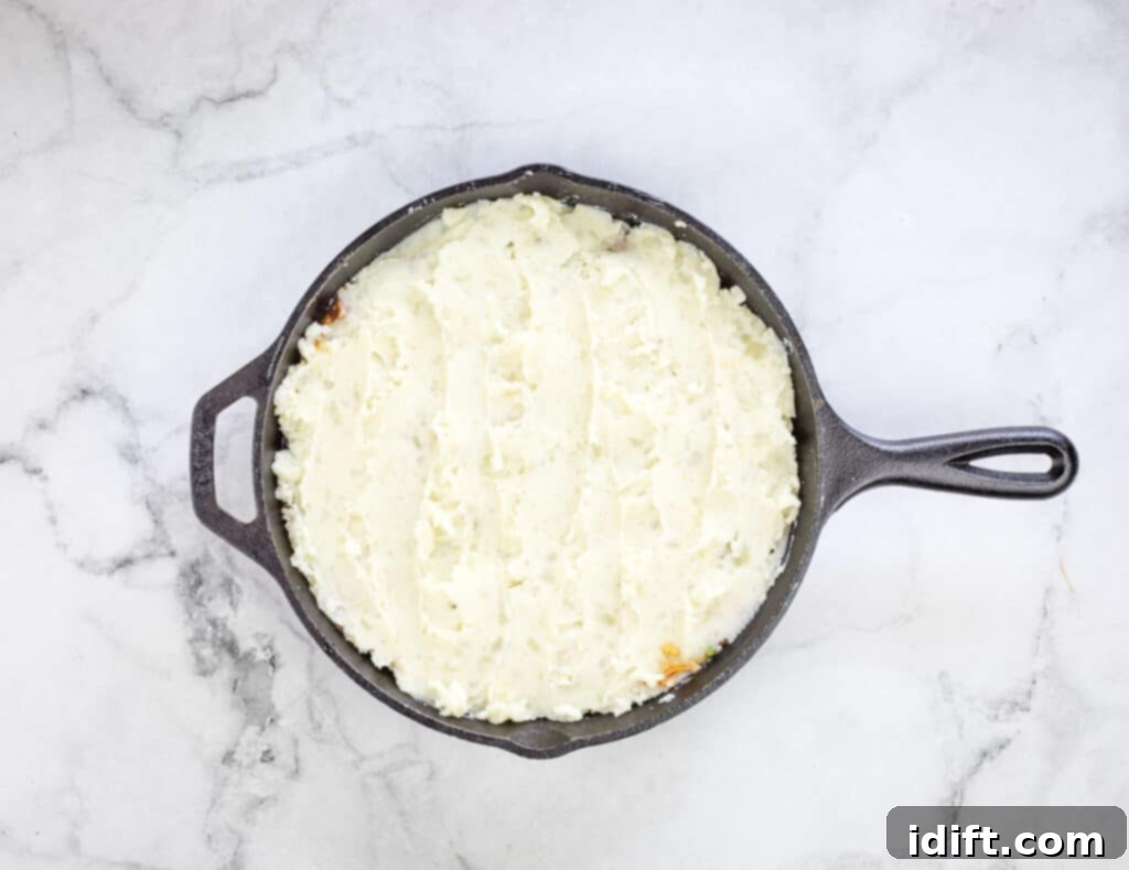 Leftover Roast Beef Shepherd's Pie topped with a smooth layer of mashed potatoes.