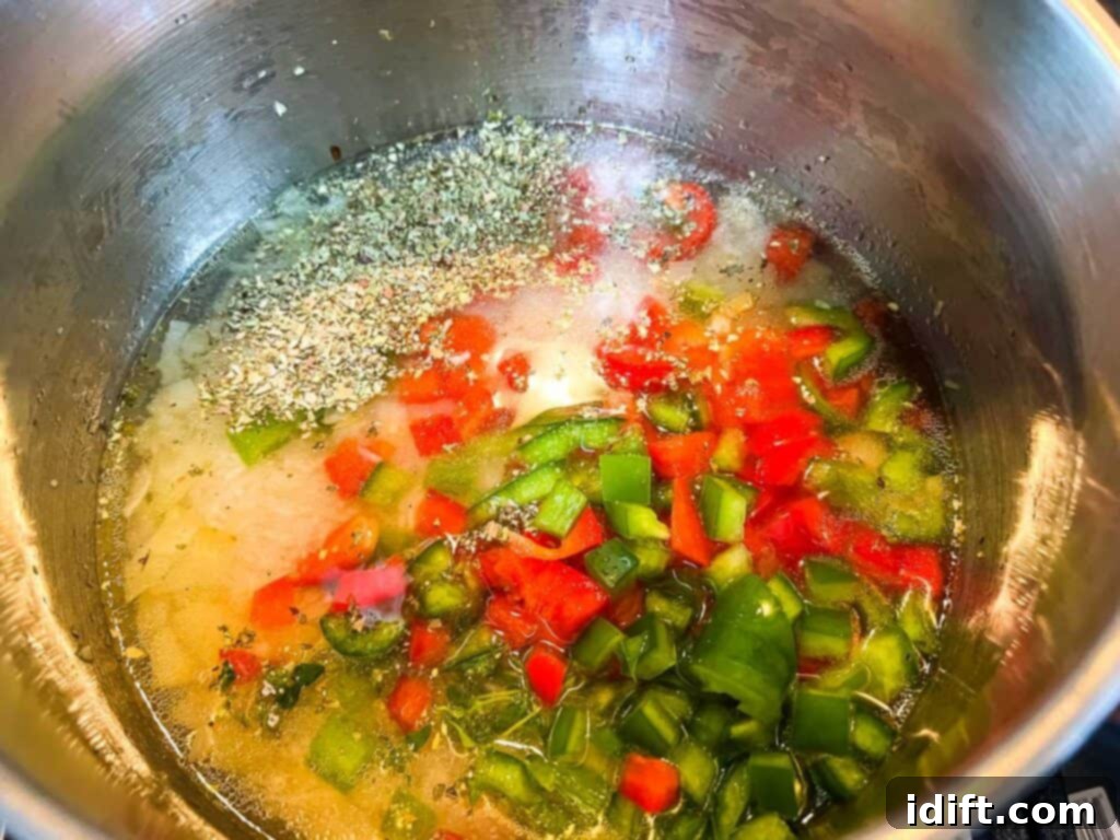 Vibrant Mediterranean Rice 8 Rice, water, and remaining ingredients added to the saucepan, ready to cook.