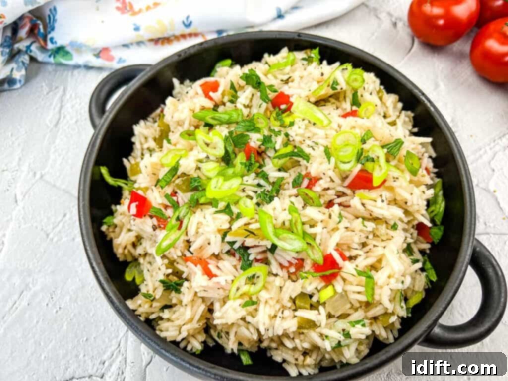 Vibrant Mediterranean Rice 9 Finished Mediterranean Rice recipe in a black serving bowl, ready to be enjoyed.