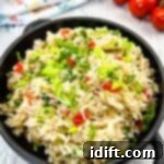 Vibrant Mediterranean Rice 10 Mediterranean Rice in a black serving bowl.