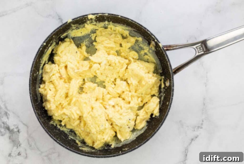 Scrambled eggs in a skillet.