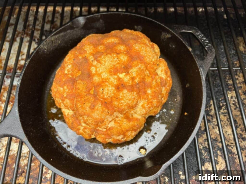 Spice-rubbed smoked cauliflower on the smoker.