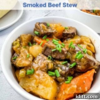 A hearty Smoked Beef Stew served in a rustic white bowl, highlighting a dish that pairs well with the drink's depth.