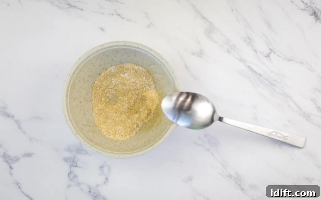 Griddle Gold: The Art of the Blackstone Smash Burger 8 A small bowl containing a mixed seasoning blend for the smash burgers.