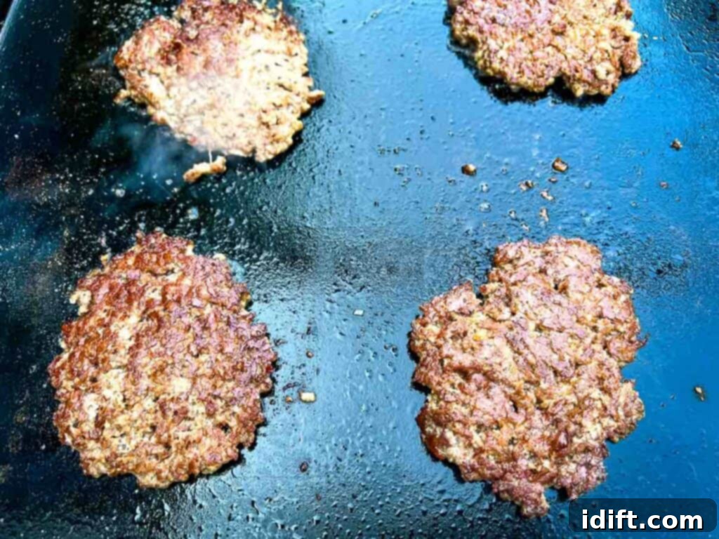 Griddle Gold: The Art of the Blackstone Smash Burger 12 Seasoned and cooked patties with a beautiful crust on a griddle, ready to be flipped or served.