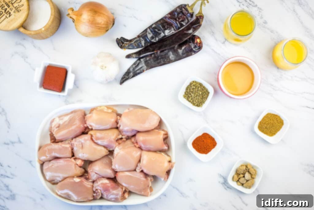 All fresh ingredients laid out on a cutting board, ready to make Smoked Chicken Al Pastor.
