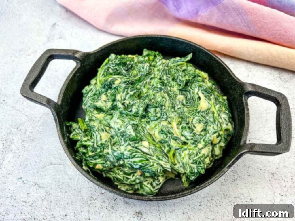 Velvet Mascarpone Spinach Your Ultimate Creamy Side 10 Finished Creamed Spinach with Mascarpone in a black serving dish.