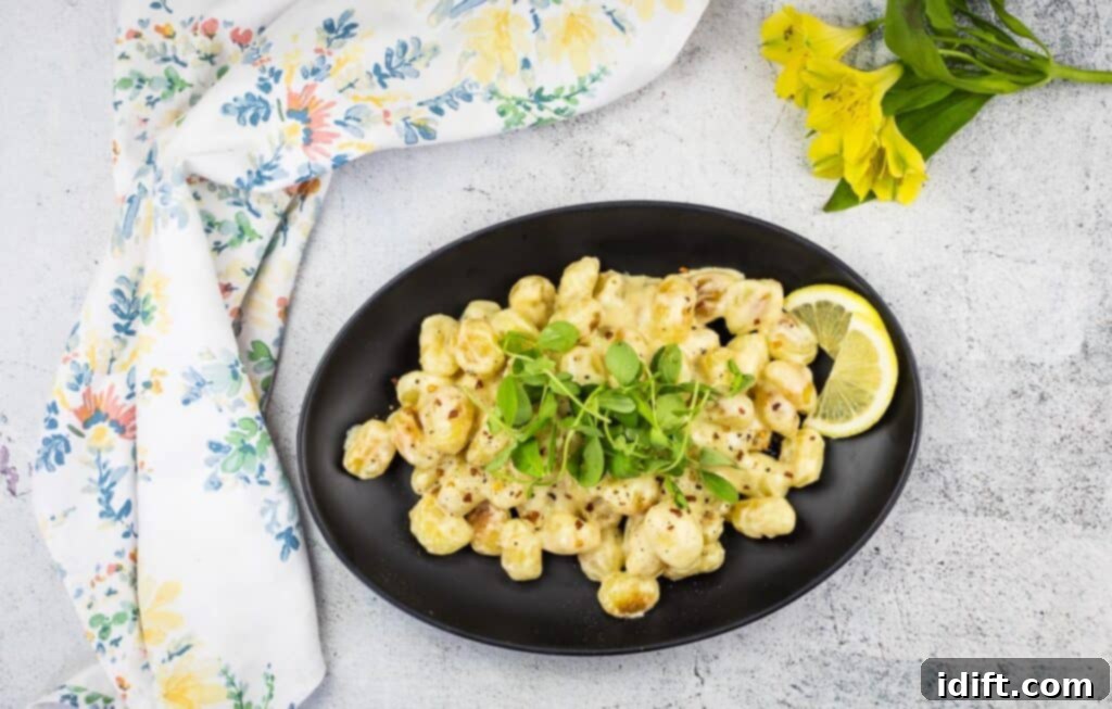 A top-down shot of a plate of gnocchi with lemon sauce, ready to be enjoyed.