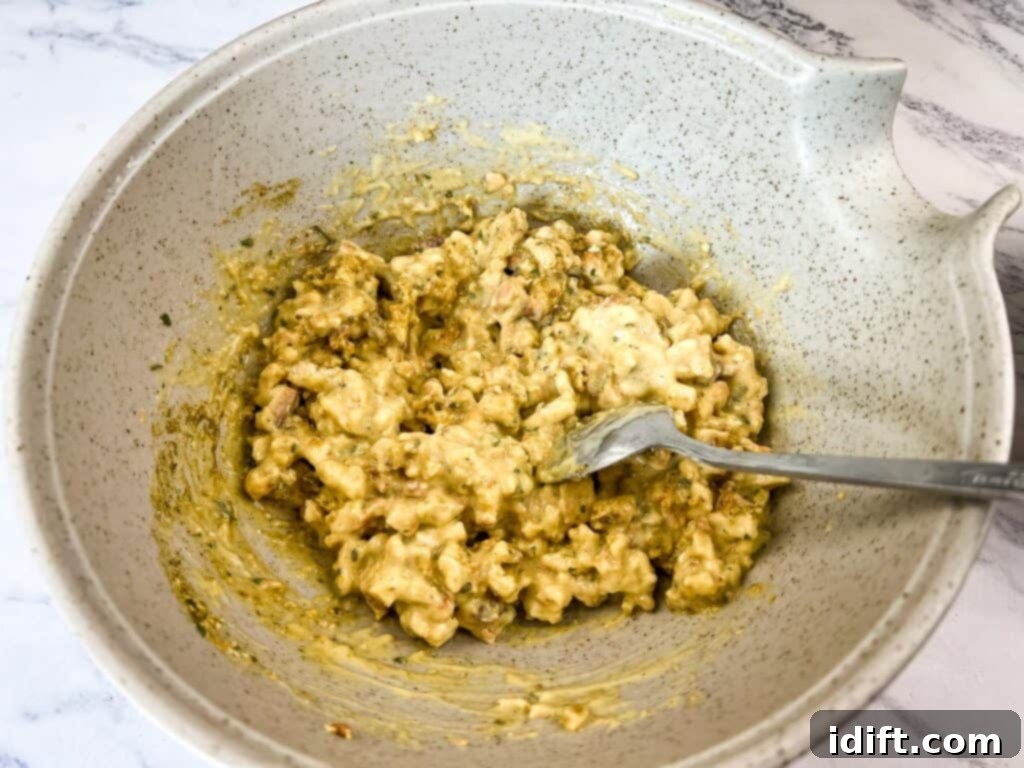 Mixed soup and stuffing in a bowl, ready to be spread.