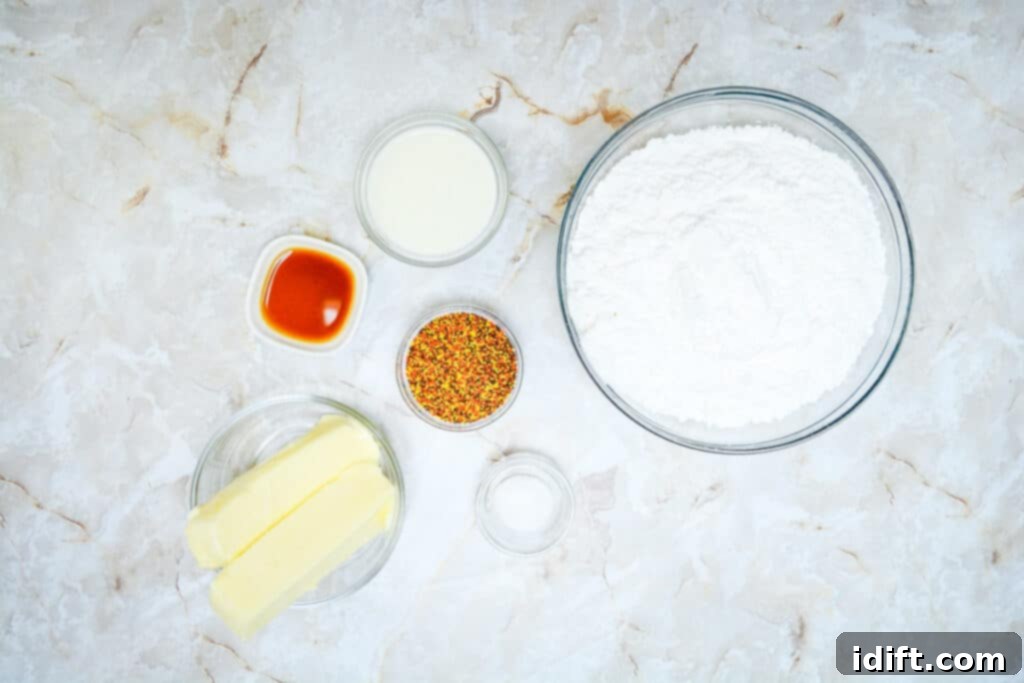 Autumn Fudgy Brownie Bites 15 Layout of essential ingredients for making fluffy buttercream icing: softened butter, powdered sugar, vanilla extract, and milk.