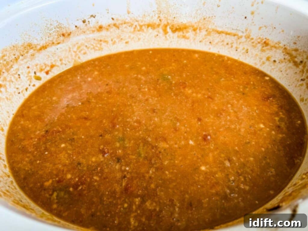 Half of the slow cooker sauce pureed for a smooth, rich consistency.