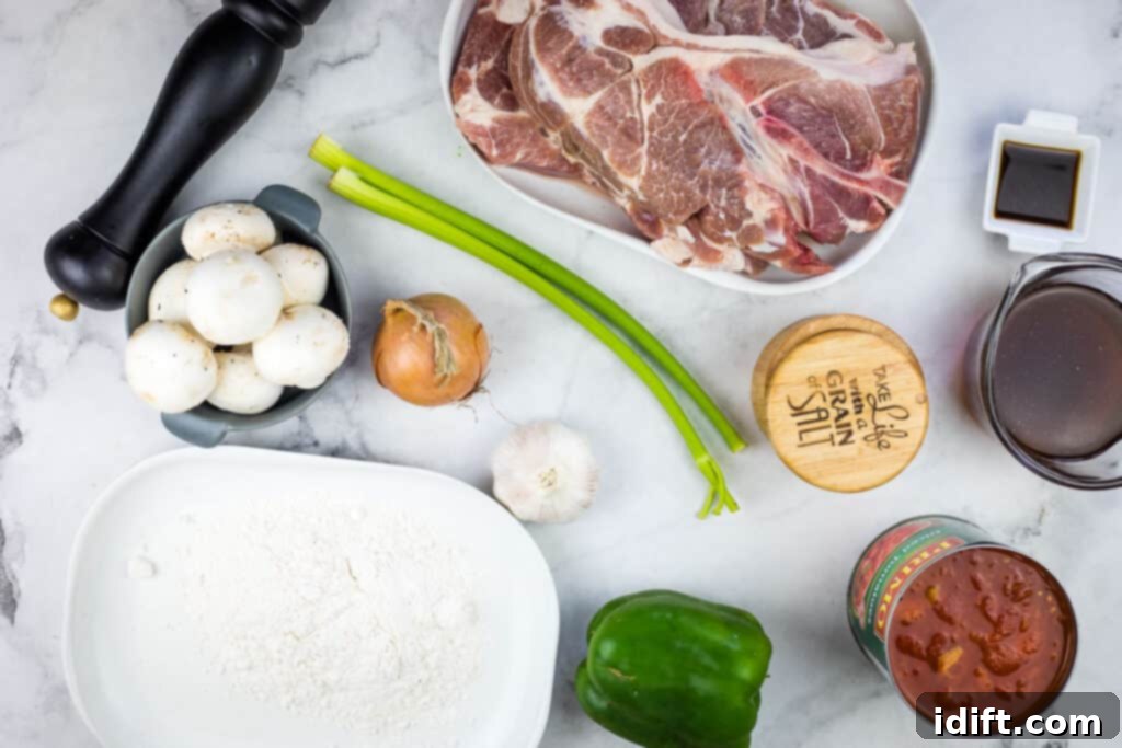 Ingredients for Slow Cooker Swiss Pork Chops laid out on a counter.