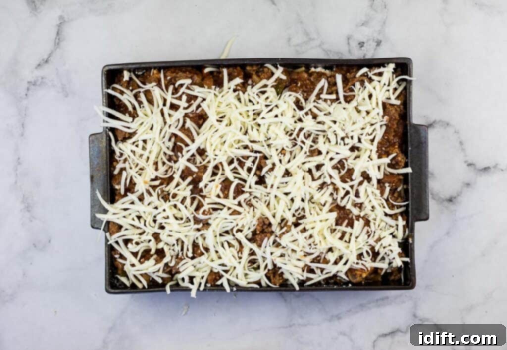 Priceless Pasta Bake 16 A casserole dish with cheese on top.