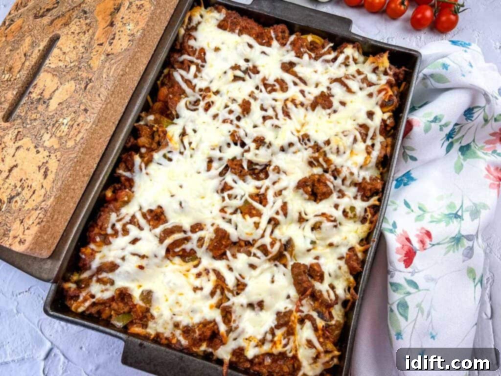 Priceless Pasta Bake 5 A casserole dish with meat, cheese and tomatoes.