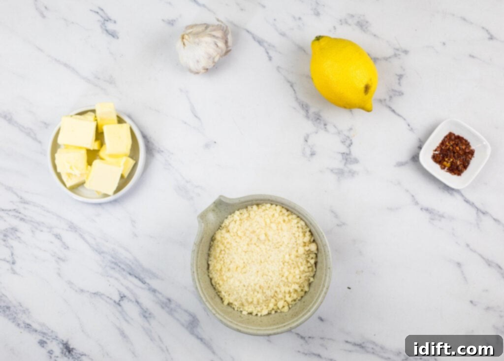 Irresistible Smoked Garlic Parmesan Wings 6 Bowls of parmesan, butter, garlic and lemon on a marble table.