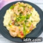 Comforting Baked Shrimp and Grits Casserole 22 Shrimp and grits on a plate.