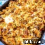 Hearty Sloppy Joe Noodles 6 A casserole dish filled with Sloppy Joe pasta and melted cheese.