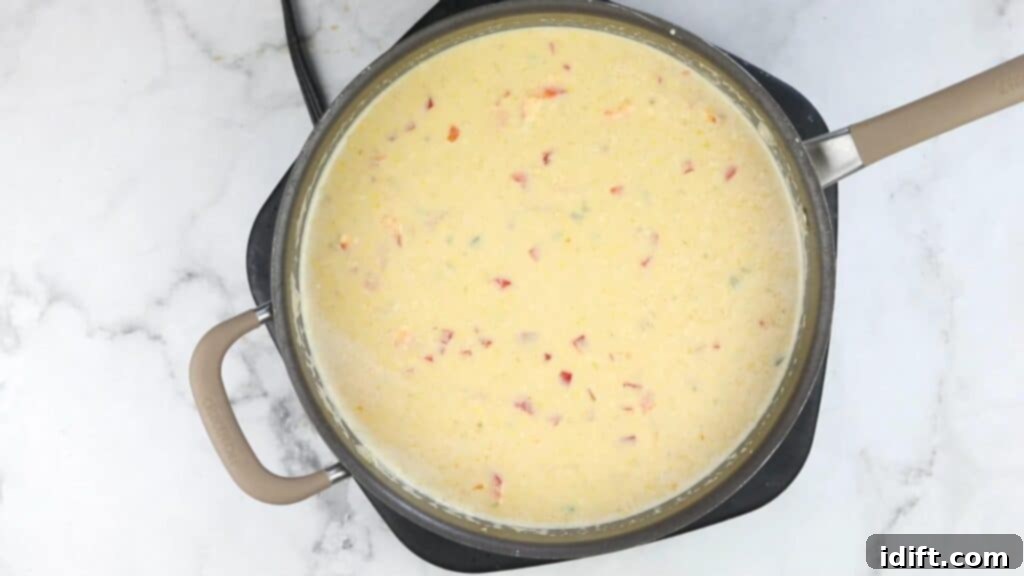 Finished street corn soup in a pot, ready to be served.