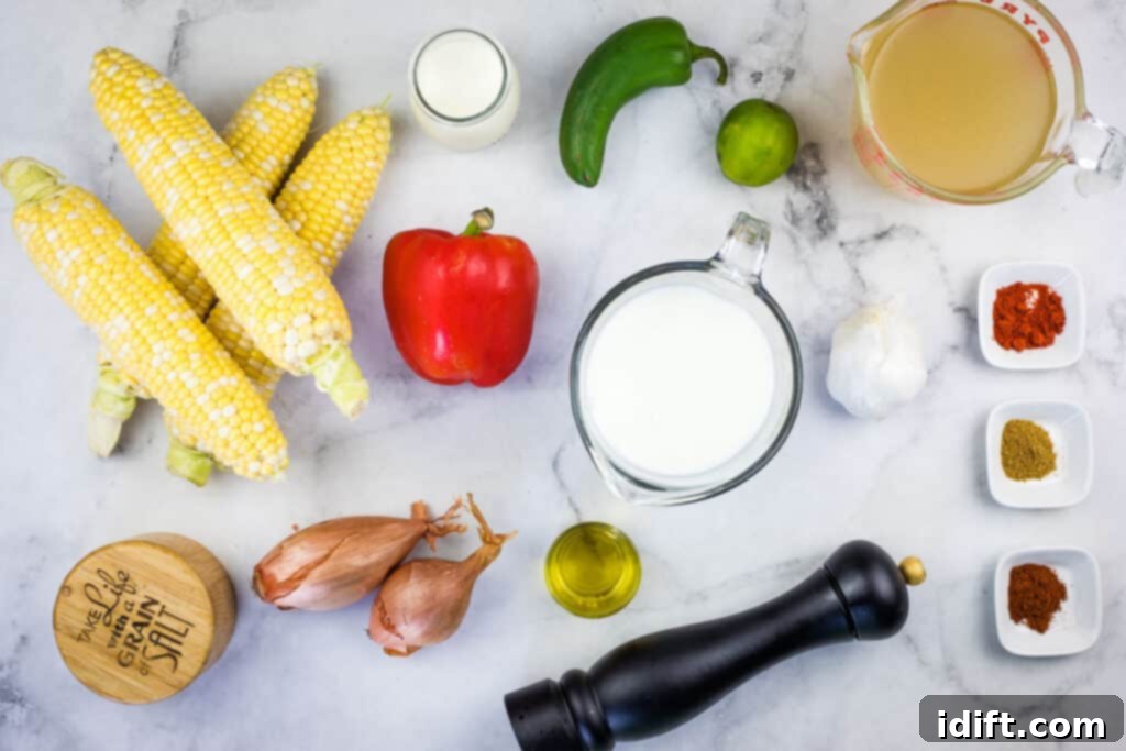 A collection of fresh ingredients laid out for making Mexican street corn soup.