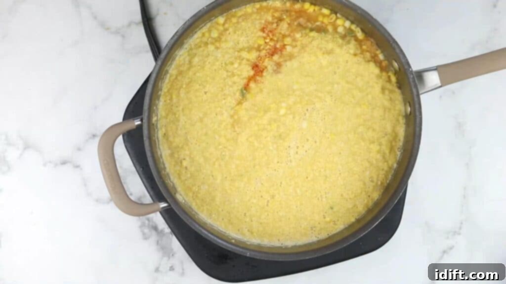 A pot of pureed soup, smooth and creamy in texture.