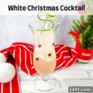 Soothing Lemon Ginger Toddy Blend 5 A white christmas cocktail with cranberries and limes.