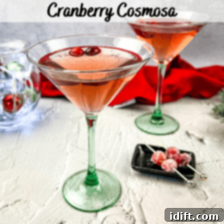 Two martini glasses filled with cranberry cosmosas.