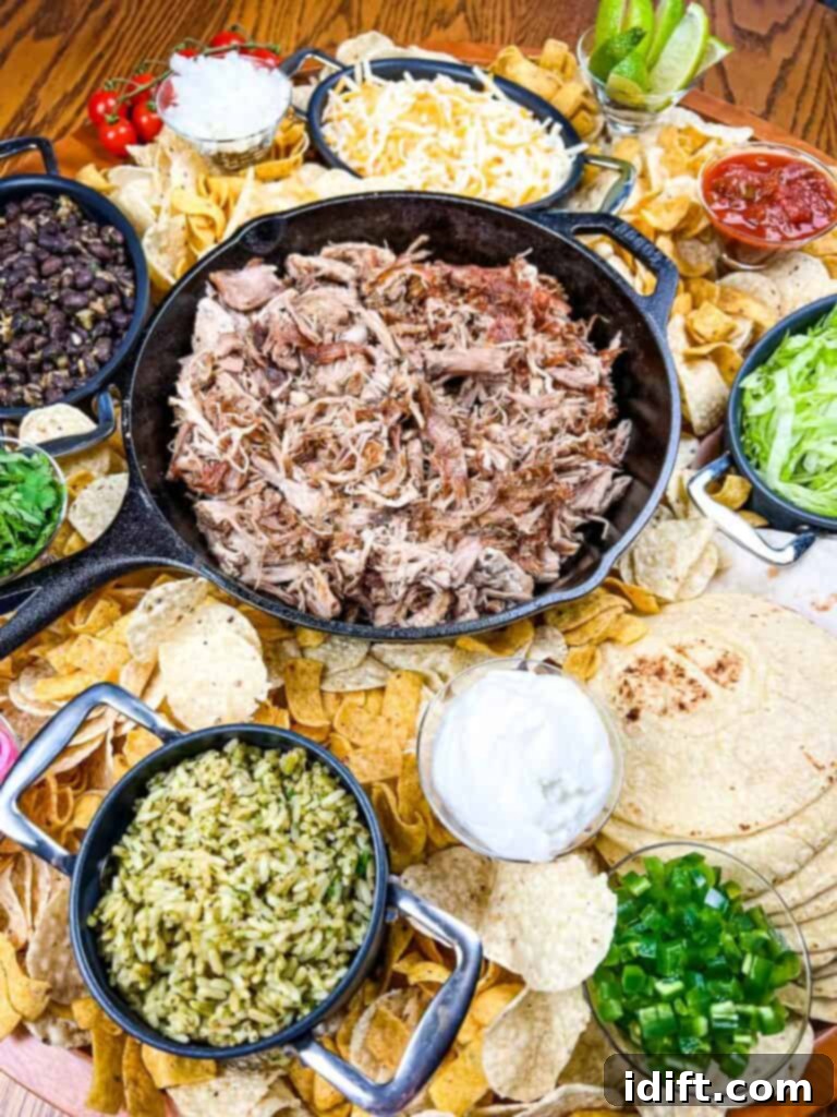 The Perfect Slow Cooker Pork Carnitas Spread 2 A large platter of mexican food on a table.
