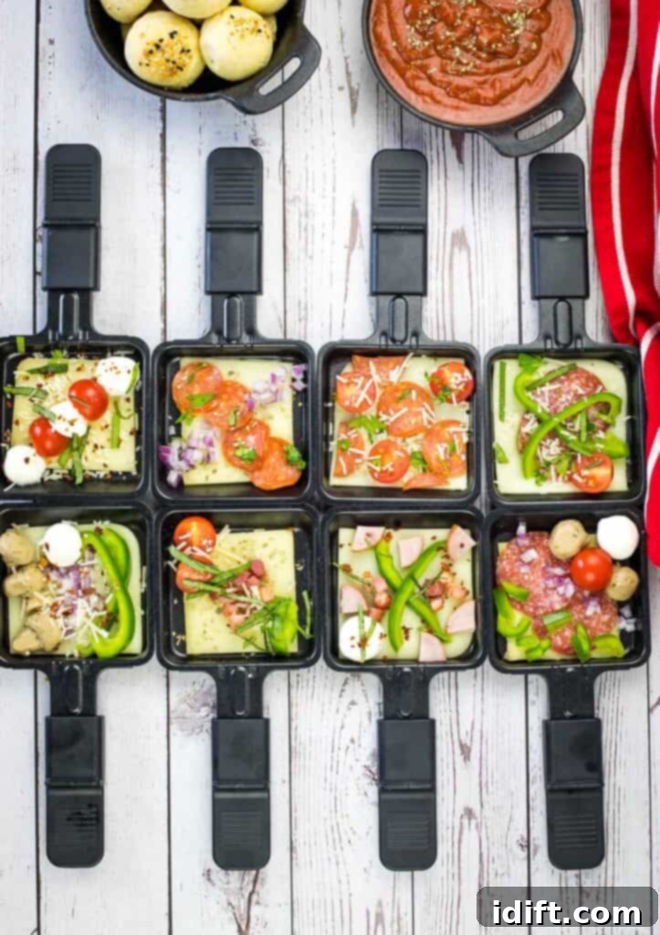 A set of black trays with food in them.