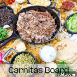 A vibrant carnitas board on a rustic wooden table, featuring shredded pork, various salsas, avocado, and tortillas.