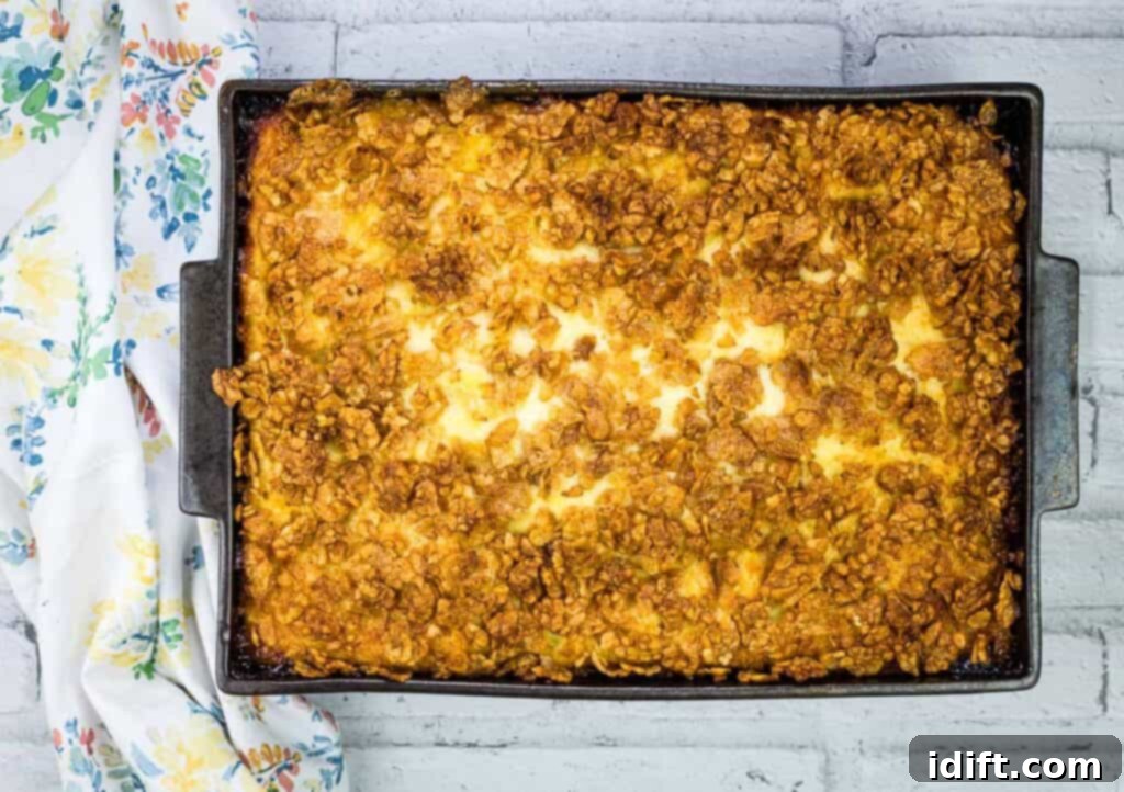 Cubano Casserole 3 A golden-brown, cheesy Cuban Sandwich Casserole, fresh from the oven, sits invitingly in a glass baking dish, ready to be served.