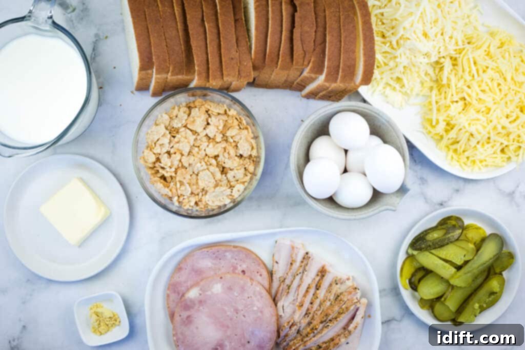 Cubano Casserole 6 Assorted ingredients for Cuban Sandwich Casserole, including ham, eggs, bread, pickles, and milk, neatly arranged on a pristine marble table surface.
