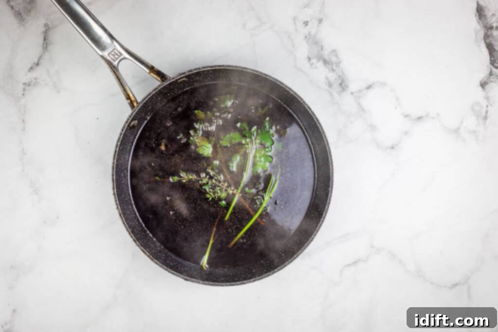 A frying pan filled with vegetables and herbs, with red wine being added for deglazing.