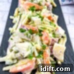 Sun-Kissed Potato and Golden Bean Salad 13 A plate of potato salad with yellow beans and parsley.