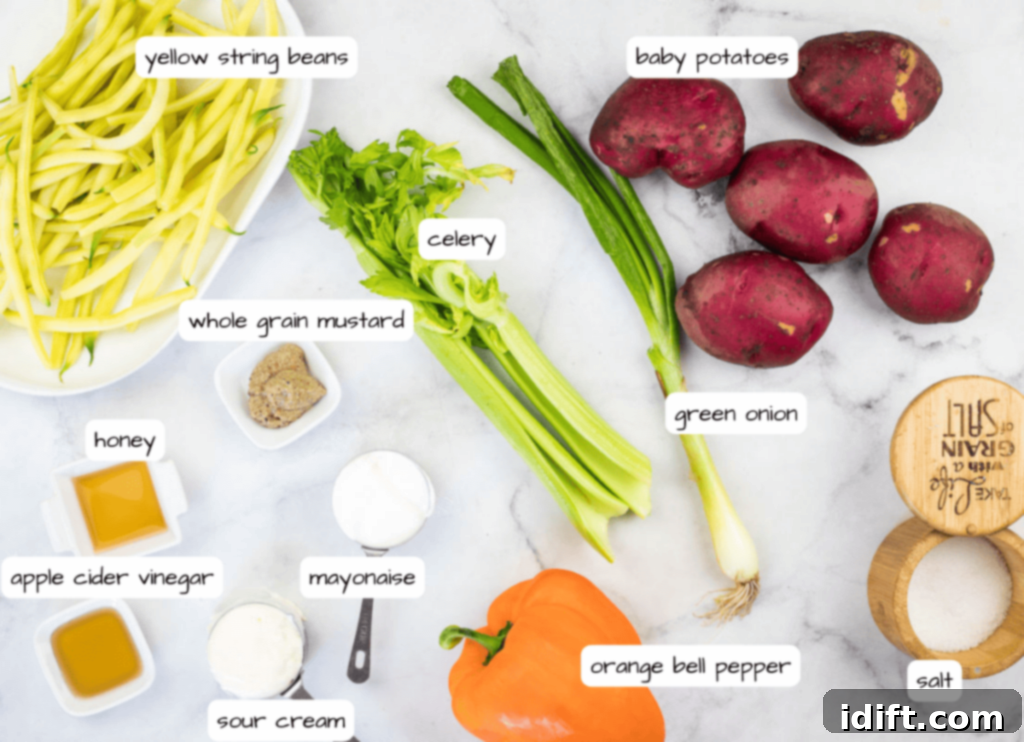 Sun-Kissed Potato and Golden Bean Salad 5 The ingredients for a zucchini soup are laid out on a marble table.