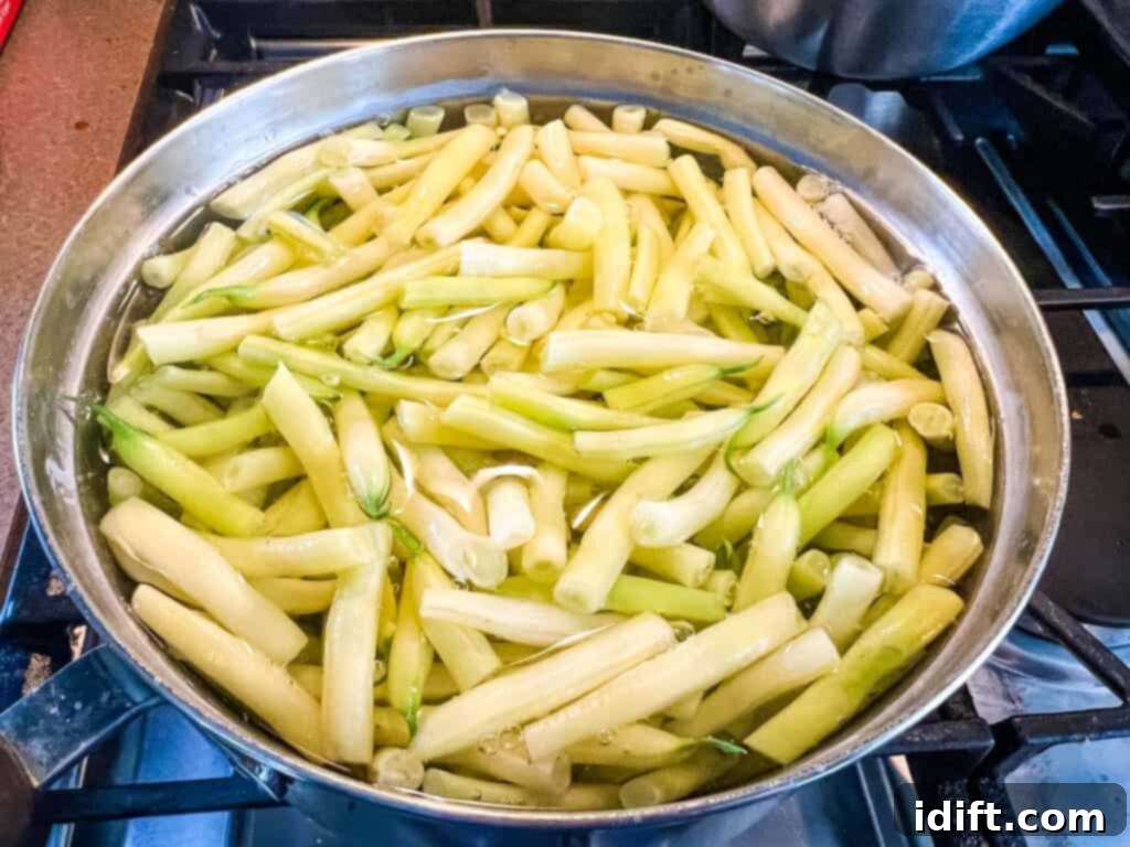 Sun-Kissed Potato and Golden Bean Salad 7 A pot full of yellow beans on a stove top.