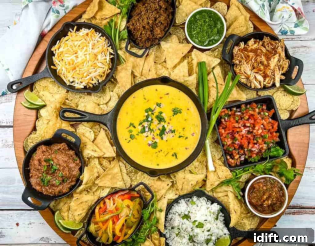 Mega Nacho Spread 4 A meticulously arranged Nacho Snack Board showcasing tortilla chips, salsa, guacamole, and various other fresh toppings.