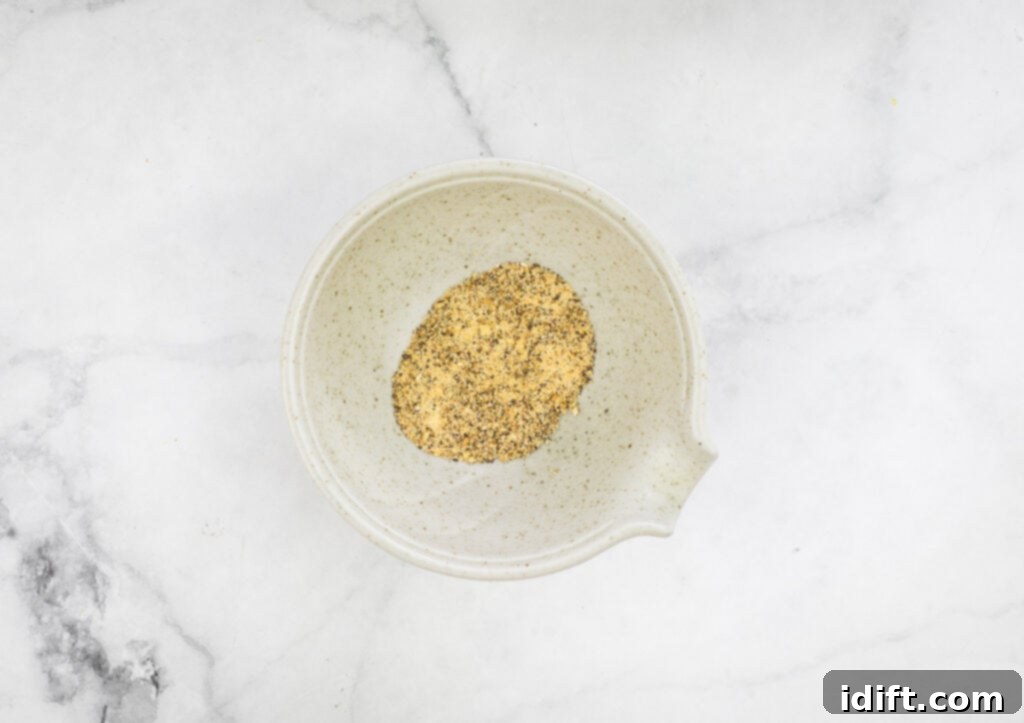 A small white bowl containing the seasoning blend for the beans.