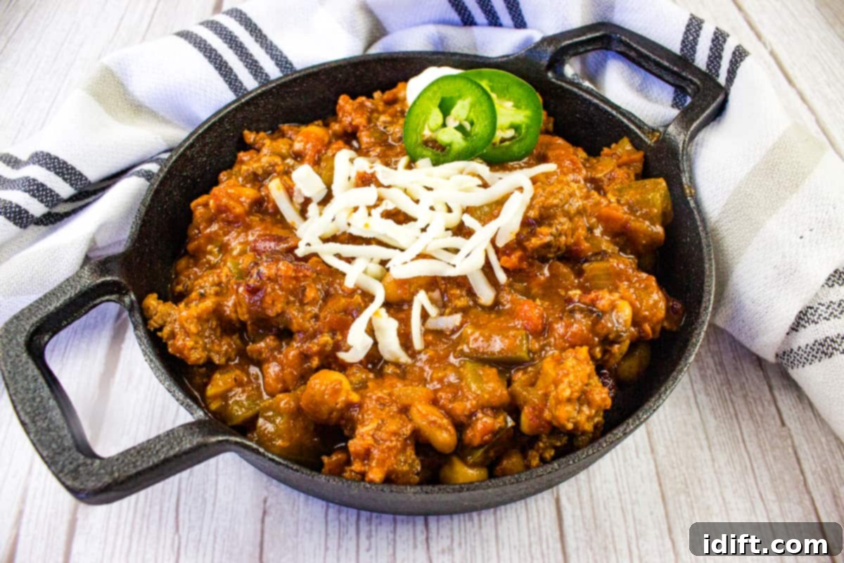 Over the Top Chili in a black cast iron bowl.