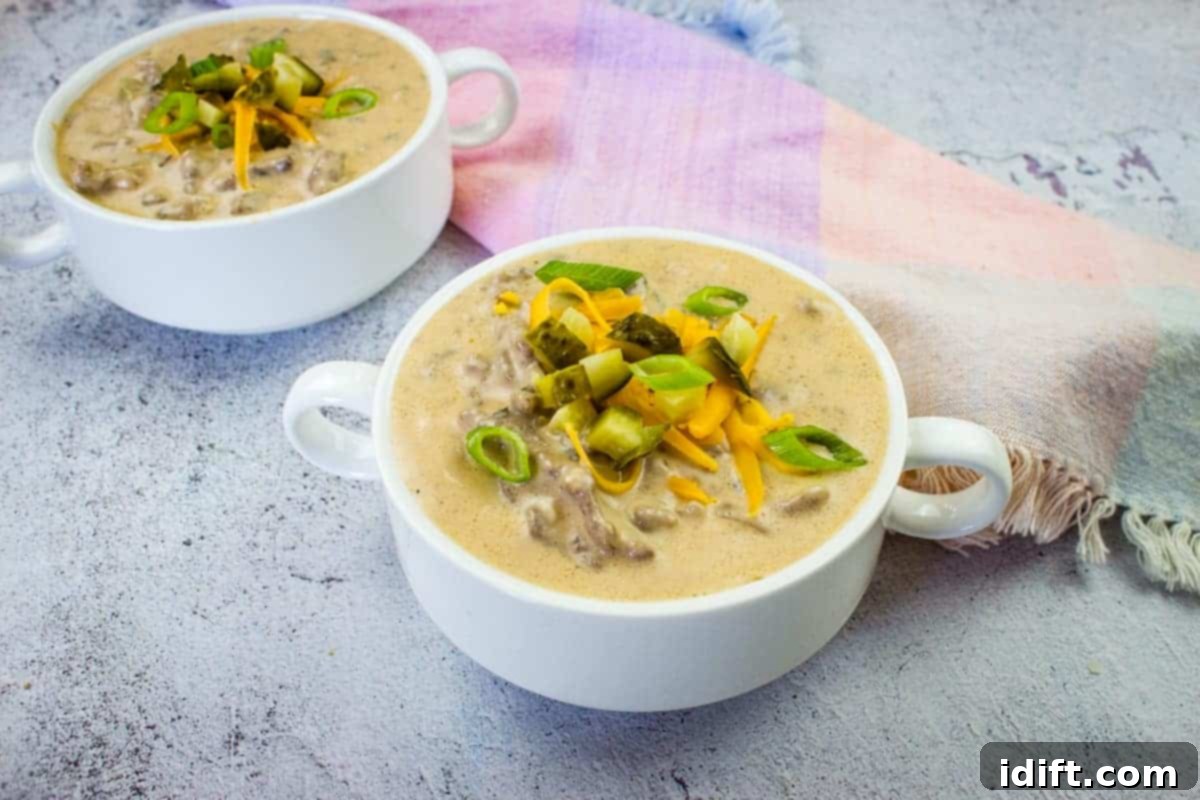 Cozy Comfort: 23 Soups, Stews, and Chilis Ready to Ladle 7 Two serving bowls of rich Cheeseburger Soup, garnished with fresh toppings.