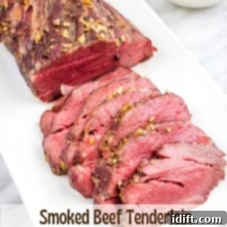 Succulent Traeger Smoked New York Strip Roast 11 Platter of perfectly sliced smoked beef tenderloin, ready for serving.