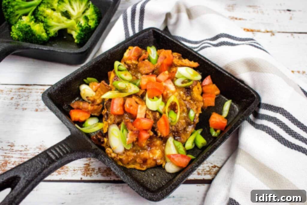 25 Low-Carb Recipes That Outshine the Classics 2 Monterey Chicken in a black dish, topped with cheese and bacon.