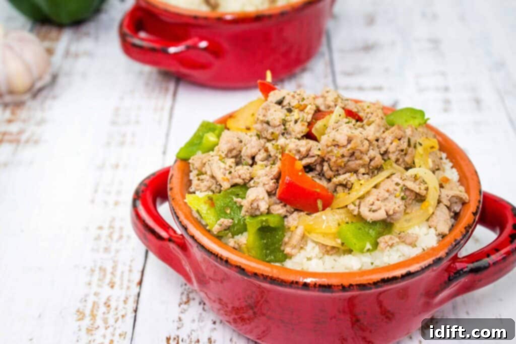 Keto Turkey and Peppers in a red serving bowl, highlighting colorful bell peppers.