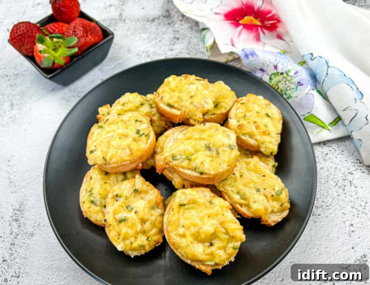 Timeless Comfort: Grandma's Kitchen Favorites 6 Bite-sized Cheese Toasties on a black plate, with golden-brown bread and melted cheese.