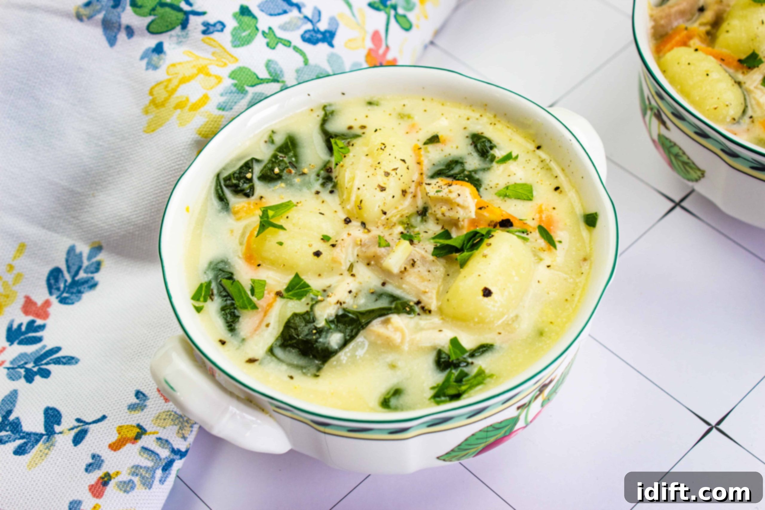 21 Italian Dishes Nonna Will Rave About 2 Two Chicken Gnocchi Soup copycat soup recipes on a table.