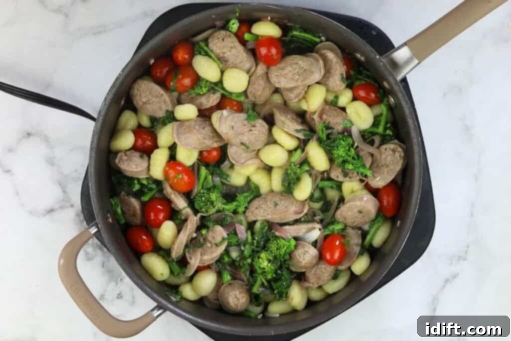 Pillowy packaged gnocchi added directly to the skillet with the sauce, sausage, and vegetables.