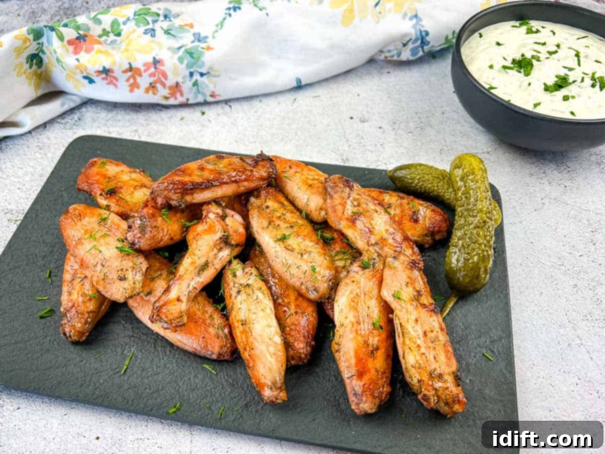 27 Effortless Chicken Meals for Your Busiest Nights 6 Platter of Smoked Dill Pickle Wings with fresh dill and pickle slices.