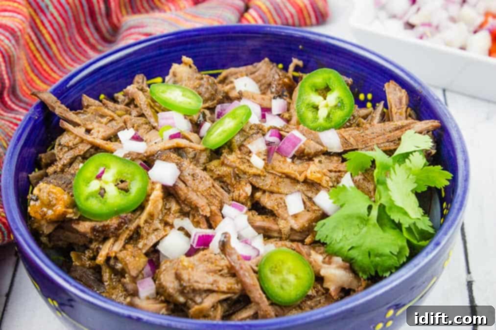 9 Make-Ahead Meals You'll Crave All Week 6 Beef Barbacoa in a blue bowl.