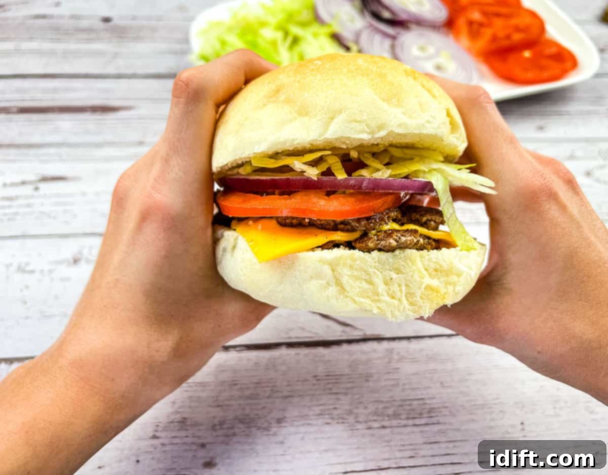 17 Prize Winning Beef Recipes 10 A burger held in two hands.