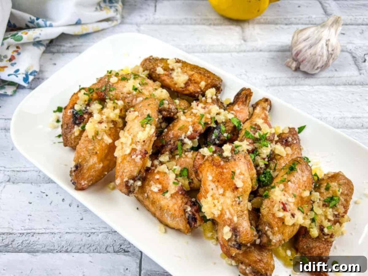 21 Family Dinners for a Lighter, Brighter You 2 Garlic Parmesan Wings on a platter.